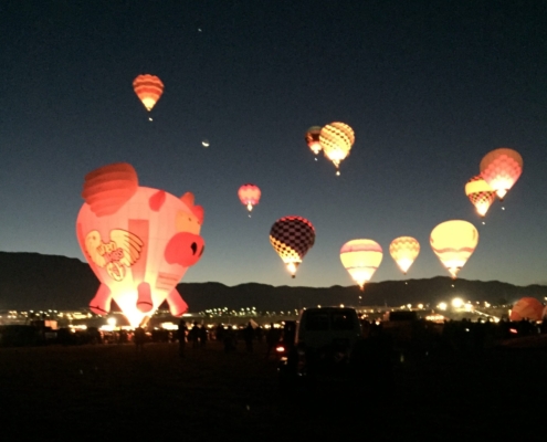 Albuquerque Balloon Fiesta - Photo of Illuminated Hot Air Balloons Flying in the Bosque of New Mexico